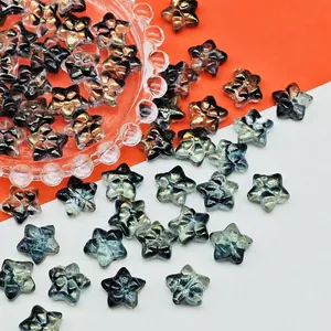 Detailed macro view of 14x14x8mm iridescent star-shaped glass beads for jewelry DIY projects