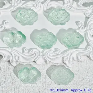 Detail view of green carved cloud glass beads for DIY jewelry making, size 9x13x4mm