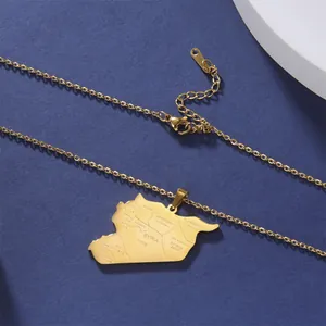 Macro view of gold-plated stainless steel Syria map pendant with city engravings