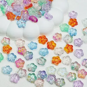 Detailed macro view of colorful gradient sakura glass flower beads for DIY jewelry