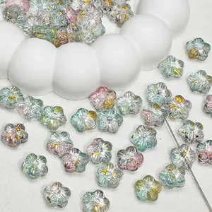 Detail view of gradient cherry blossom glass beads with gold foil for DIY jewelry