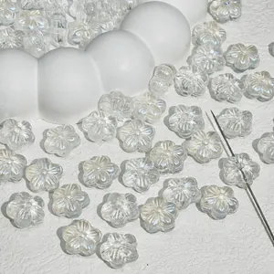 Detail macro view of transparent glass cherry blossom beads for handmade DIY jewelry crafting