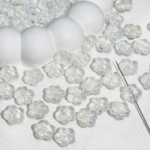 Detail macro view of transparent glass cherry blossom beads for handmade DIY jewelry crafting