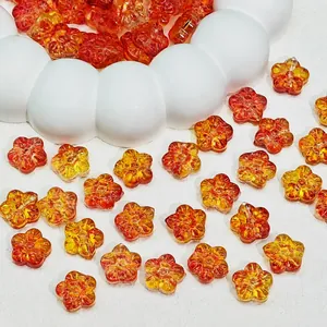 Close-up of gradient orange glass sakura beads measuring 12x12x7mm