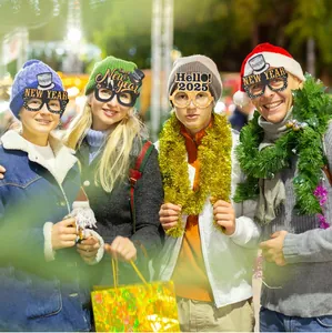 Set of Happy New Year 2025 party glasses worn by models in festive outdoor setting