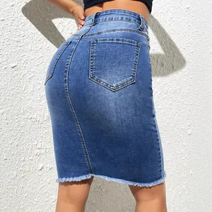 High waisted blue denim pencil skirt featuring a frayed hem and stretch bodycon fit
