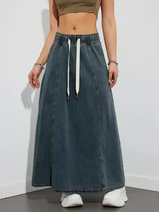 Detailed view of elastic waist denim maxi skirt with drawstring and paneled design