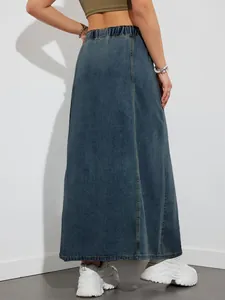 Detailed back view of a high-waisted denim maxi skirt featuring a comfortable elastic waistband.