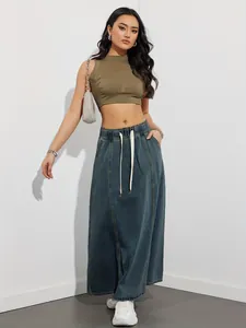 Detailed view of women's long denim skirt with a comfortable elastic waist and drawstring design.