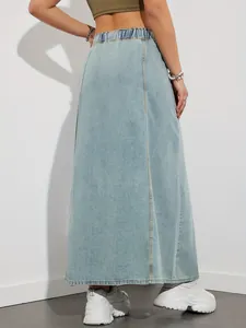 Back view of a long light blue denim skirt with elastic waist and a-line silhouette