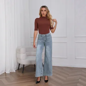 Professional model wearing high-waisted light blue wide-leg jeans with front pockets