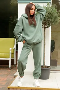 Full view of women's sage green hooded sweatshirt and jogger pants two-piece leisure set