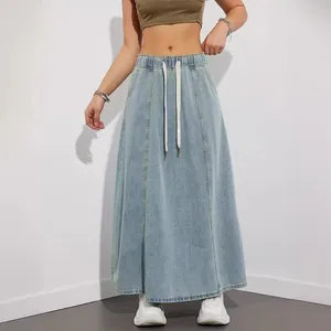 High-waisted light blue denim maxi skirt featuring a drawstring and elastic waistband