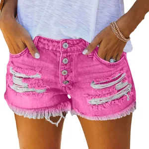 Vibrant pink high-waisted distressed denim shorts with a frayed hem and button fly closure