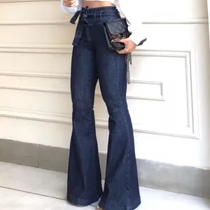 High-waist dark blue flare jeans with a tie-belt and wide-leg design for women.