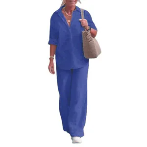 Casual blue two-piece set featuring a long-sleeve shirt and matching wide-leg trousers.