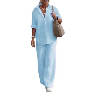 Detailed look at light blue linen two-piece set featuring long-sleeve shirt and wide-leg pants