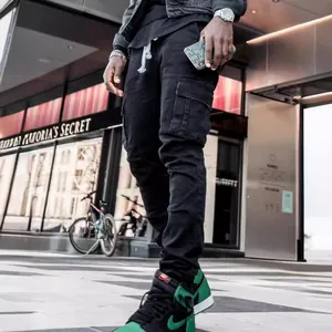 Professional men's slim fit black cargo jeans with side pockets in urban street style