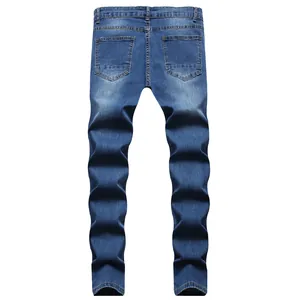 Detailed rear view of men's slim fit blue denim jeans with classic washed texture