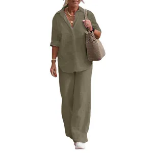 Casual olive green two-piece outfit featuring a collared shirt and wide leg trousers.