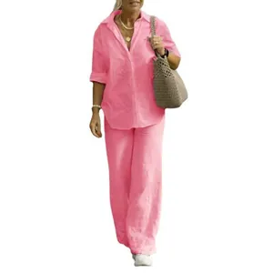 Women's pink linen-style two-piece set with long-sleeve shirt and wide-leg trousers