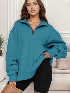 Felpa da donna oversize con mezza zip color verde ottanio e stile sportivo alla moda
