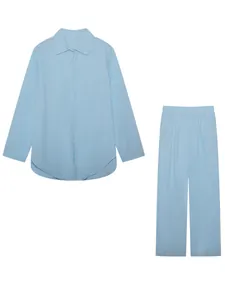 Light blue two-piece casual set featuring a long-sleeved shirt and wide-leg pants