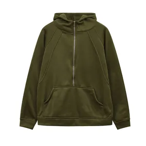 Close-up front view of olive green half-zip hooded sweatshirt with pocket