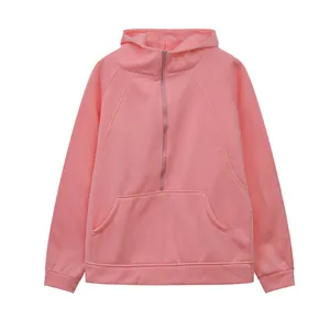 Detailed view of a pink half-zip fleece hooded sweatshirt with kangaroo pocket