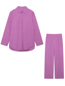 Detailed view of the purple long-sleeved shirt and matching wide-leg trousers set