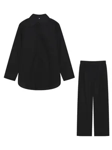 Detail view of a black two-piece set featuring a lapel shirt and wide-leg trousers.