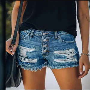 Trendy blue distressed denim shorts for women featuring fringe detail and button fly design
