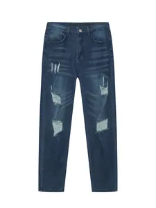 Detailed view of men's slim fit distressed blue denim jeans with ripped knee design.