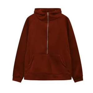 Front view of a maroon half-zip hoodie with a kangaroo pocket and ribbed cuffs