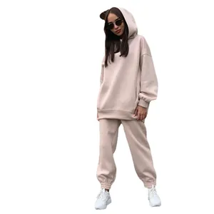 Stylish women's oversized hooded sweatshirt and matching jogger two-piece set.