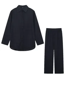Detailed view of the dark navy two-piece long sleeve shirt and wide leg pants set.