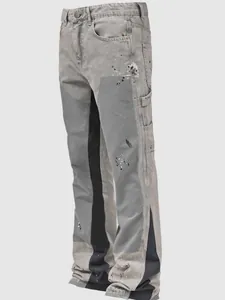 Detail view of mens gray washed denim cargo pants with paint splatter and stacked flared fit