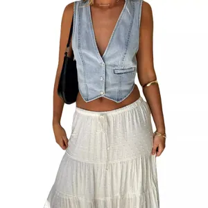 Fashionable women's light blue denim vest waistcoat styled with a white tiered skirt
