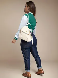 Detailed back view of a stylish green and white color-block women's baseball jacket.