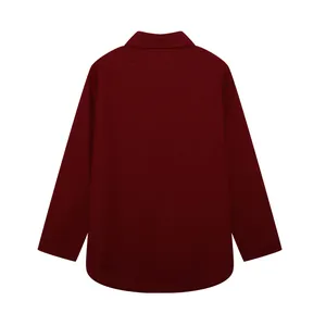 Detailed back view of a burgundy long-sleeved lapel shirt featuring a curved hemline