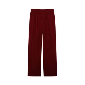 Casual solid color wide-leg pants with comfortable elastic waistband in deep red hue