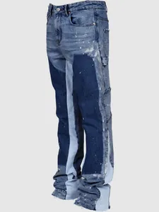 Side detail of men's patchwork denim carpenter flare pants with paint splatter elements