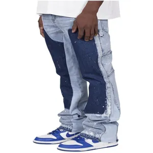 Detailed view of men's blue patchwork flared denim cargo pants featuring a layered design
