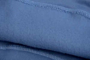 Detailed macro view showing the soft blue fleece lining texture of a women's cropped sweatshirt