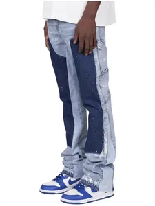 Men's contrast patch stacked flare carpenter jeans featuring white paint splatter details