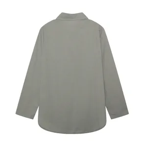 Back view of casual grey long-sleeved button-up shirt featuring a rounded curved hemline