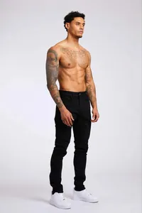 Jean noir slim pour homme avec taille haute et coupe crayon de tendance actuelle