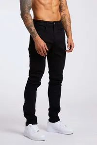 Vue détaillée d'un jean skinny noir pour homme avec coupe haute et design ajusté