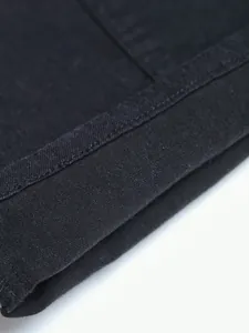 Detailed close-up showing the high-quality stitching and black denim fabric texture.