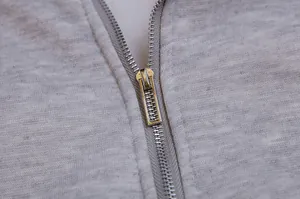 Macro view showing the silver metal zipper detail on gray heathered fleece hoodie